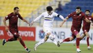 Ahmed Alaaeldin (centre) in action during match against Al Markhiya yesterday.  