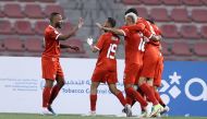 Al Arabi players celebrate during QSL match against Umm Salal yesterday. 