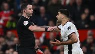 In this file photo taken on March 19, 2023 Fulham's Serbian striker Aleksandar Mitrovic (R) argues with English referee Chris Kavanagh (L) and gets himself sent off during the English FA Cup quarter-final football match between Manchester United and Fulham at Old Trafford in Manchester, north-west England. (Photo by Paul ELLIS / AFP) 