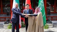 This handout picture provided by the Iranian foreign ministry shows Iran's Foreign Minister Hossein Amir-Abdollahian (L) shaking hands with Saudi Foreign Affairs Minister Prince Faisal bin Farhan and Chinese Foreign Minister Qin Gang (C) during a meeting in Beijing on April 6, 2023. (Photo by Iranian Foreign Ministry / AFP)