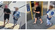 An undated handout framegrab received on April 6, 2023 from the Queensland Police Service shows a man (L) carrying a rare, wild platypus at a train station near Brisbane. (Photo by Handout / Queesland Police Service / AFP) 