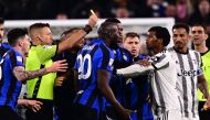 Inter Milan’s forward Romelu Lukaku (centre) argues with Juventus’ midfielder Juan Cuadrado from Colombia during the Italian Cup semi-final first leg football match between Juventus and Inter Milan on April 4 2023 at the 