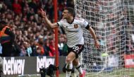Manchester United's Portuguese defender Diogo Dalot celebrates after scoring their second goal during the English Premier League football match between Nottingham Forest and Manchester United at The City Ground in Nottingham, central England, on April 16, 2023. (Photo by DARREN STAPLES / AFP) 