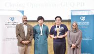 Representatives of the Georgetown Debating Union at Georgetown University in Qatar with the medals and trophy.