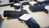 In this file photo taken on March 26, 2018 a Remington RP9 9mm pistol sits for sale at Idol's Gun Rack gun shop in Kernersville, North Carolina. (Photo by Brian Blanco / GETTY IMAGES NORTH AMERICA / AFP)
