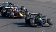 Mercedes' British driver Lewis Hamilton leads Red Bull Racing's Dutch driver Max Verstappen during the 2023 Formula One Australian Grand Prix at the Albert Park Circuit in Melbourne on April 2, 2023. Photo by WILLIAM WEST / AFP

