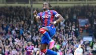 Crystal Palace's Ivorian striker Wilfried Zaha celebrates after scoring their second goal during the English Premier League football match between Crystal Palace and West Ham United at Selhurst Park in south London on April 29, 2023. Photo by JUSTIN TALLIS / AFP 
