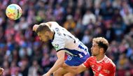 Bayern Munich's midfielder Leon Goretzka (R) and Hertha Berlin's English defender Jonjoe Kenny vie for the ball during the German first division Bundesliga football match between FC Bayern Munich and Hertha Berlin in Munich, southern Germany on April 30, 2023. (Photo by Christof STACHE / AFP)