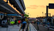 Technicians work on pit lane ahead of the Miami Grand Prix at the Miami International Autodrome in Miami Gardens, Florida, on May 3, 2023. Photo by CHANDAN KHANNA / AFP