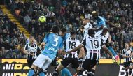 Napoli's Nigerian forward Victor Osimhen (Top right) and Udinese's Brazilian defender Rodrigo Becao (2nd right Top) go for a header during the Italian Serie A football match between Udinese and Napoli on May 4, 2023 at the Friuli stadium in Udine. (Photo by Tiziana Fabi / AFP)