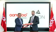 Ooredoo and Axon officials at the signing of the agreement.