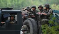 Indian Army servicemen patrol during a rescue operation following ethnic violence in the region, near Imphal, northeastern Indian state of Manipur on May 7, 2023. (Photo by Arun Sankar / AFP)