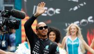 MAY 07: Lewis Hamilton of Great Britain and Mercedes walks out onto the grid prior to the F1 Grand Prix of Miami at Miami International Autodrome on May 07, 2023 in Miami, Florida. Photo by Chris Graythen / GETTY IMAGES NORTH AMERICA / Getty Images via AFP