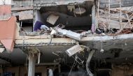 A damaged building is pictured after an Israeli airstrike in Gaza City, Palestininan Territories on May 9, 2023. (Photo by MOHAMMED ABED / AFP)