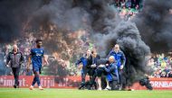 A supporter storms the field during the Dutch Premier league football match between FC Groningen and Ajax Amsterdam at the Euroborg stadium in Groeningen, on May 14, 2023 in Groningen. (Photo by Cor Lasker / various sources / AFP)