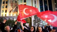 Supporters of Turkish President Recep Tayyip Erdogan and AK Party (AKP) wave flags at the AK Party headquarters in Ankara, Turkey May 14, 2023. AFP/Adem ALTAN (Photo by Adem Altan / AFP)
