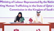 Minister of Labour H E Dr. Ali bin Smaikh Al Marri (right) and Chairman of Human Rights Commission of Saudi Arabia and Chair of the Committee to Combat Crimes of Trafficking in Persons H E Dr. Hala bint Mazyed Al Tuwaijri signing an MoU for cooperation in the field of combating human trafficking, in Doha, yesterday.