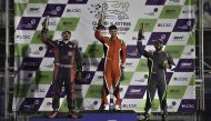 The 2023 Qatar Karting Championship winner Bader Al Sulaiti celebrates on the podium along with Faesal Al Yafei and Omar Aswat.  
Final 