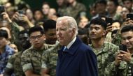 US President Joe Biden greets US soldiers as he arrives to attend the G7 Summit at the US Marine Corps base in Iwakuni on May 18, 2023. (Photo by Brendan Smialowski / AFP)