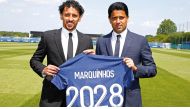 Paris Saint-Germain President and CEO Nasser bin Ghanim Al Khelaifi and captain Marquinhos hold a team jersey after the Brazilian defender's contract was extended until 2028. PIC: PSG