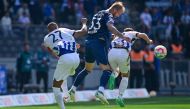 :Hertha Berlin's Ghanaian midfielder Kevin-Prince Boateng (L), Bochum's German forward Philipp Hofmann (C) and Hertha Berlin's German forward Marco Richter vie for a header during the German first division Bundesliga football match between Hertha Berlin and VfL Bochum in Berlin, Germany, on May 20, 2023. (Photo by John MACDOUGALL / AFP) 