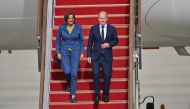 German Chancellor Olaf Scholz (R) and his wife Britta Ernst (L) arrive at Seoul Air Base in Seongnam on May 21, 2023. Photo by Jung Yeon-je / AFP