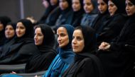 Minister of Education and Higher Education H E Buthaina bint Ali Al Jabr Al Nuaimi (3rd right), Vice-Chairperson and CEO of Qatar Foundation H E Sheikha Hind bint Hamad Al Thani (2nd right), and other officials and students at the session.