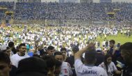 Fans invade the pitch following a stampede during a football match between Alianza and FAS at Cuscatlan stadium in San Salvador on May 20, 2023. Photo by Gabriel AQUINO / AFP