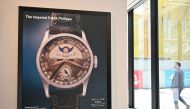 A poster of the Patek Philippe Ref 96 Quantieme Lune timepiece, once owned by Aisin-Gioro Puyi, the Chinese Qing dynasty’s last emperor, is seen on display in Phillips auction house in Hong Kong on May 23, 2023 ahead of its auction in the territory on the same day. (Photo by Peter Parks / AFP)