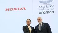 Honda Motor President Toshihiro Mibe (L) shakes hands with Aston Martin F1 executive chairman Lawrence Stroll during a press conference in Tokyo on May 24, 2023. Photo by JIJI Press / AFP
