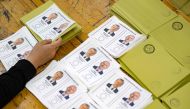 A photograph shows ballots depicting the two candidates, Recep Tayyip Erdogan (L) and Kemal Kilicdaroglu on the day of the Presidential runoff vote in a polling station in a government school in Istanbul on May 28, 2023. Photo by Yasin AKGUL / AFP