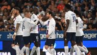 PSG's Lionel Messi (centre) celebrates with teammates after scoring a goal against RC Strasbourg Alsace. AFP