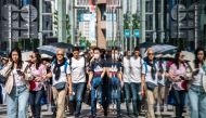 (Files) Pedestrians walk on the street in Ginza district in Tokyo on April 20, 2023. 