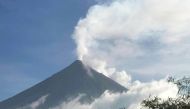 This handout photo made available by Kristin Moral shows the Mount Mayon spewing white smoke as seen from Camalig, Albay, in the Philippines, on June 8, 2023. (Photo by Handout / AFP) 