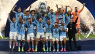 Manchester City's German midfielder #8 Ilkay Gundogan holds aloft the European Cup trophy as they celebrate winning the UEFA Champions League final football match between Inter Milan and Manchester City at the Ataturk Olympic Stadium in Istanbul, on June 10, 2023. (Photo by Paul ELLIS / AFP)