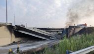 This handout image provided by the Philadelphia Office of Emergency Management on June 11, 2023, shows a portion of collapsed road caused by a large vehicle fire in Philadelphia, Pennsylvania. (Photo by Handout / Philadelphia Office of Emergency Management / AFP) 