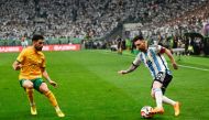 Argentina's Lionel Messi (R) fights for the ball with Australia's Mathew Leckie during a friendly football match between Australia and Argentina at the Workers' Stadium in Beijing on June 15, 2023. (Photo by Pedro Pardo / AFP)