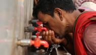 File Photo: A labourer drinks water from a public drinking water tap on a hot summer day in the old quarters of Delhi, India, May 4, 2022. (Reuters/Anushree Fadnavis)