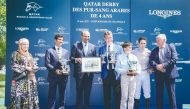 The connection of Al Ghadeer with officials during the presentation ceremony after the Al Shaqab Racing owned four-year-old Arabian won the Gr.1 (PA) Qatar Derby des Pur Sang Arabes de 4ans, at Chantilly, France. DOWN: Christophe Soumillon guides Al Ghadeer to win.
