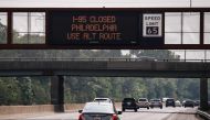 A warning sign is displayed, due to a collapsed portion of Interstate 95, caused by a large vehicle fire in Philadelphia, Pennsylvania, on the route in Lawrence Township, New Jersey, on June 11, 2023. (Photo by KENA BETANCUR / AFP)