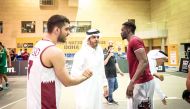 Qatar Basketball Federation (QBF) President Mohamed Saad Al Mughaiseeb congratulates Qatar players.