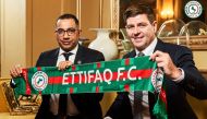 his handout picture released by Saudi Arabia's al-Ettifaq football club on July 3, 2023 shows Ettifaq's new English manager Steven Gerrard (R) with the club's President Khaled al-Debel after signing with them in London. (Photo by Al Ettifaq Football Club / AFP)