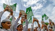 Young and adults hold copies of the Holy Quran during a demonstration in Peshawar on July 7, 2023, as they protest against the burning of the Quran outside a Stockholm mosque that outraged Muslims around the world. (Photo by Abdul Majeed / AFP)