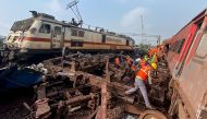 Rescue workers sift through wreckage at the accident site of a three-train collision near Balasore, about 200 km (125 miles) from the state capital Bhubaneswar, on June 3, 2023. (Photo by Dibyangshu Sarkar / AFP)