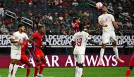 Qatar's defender Youssef Farahat (R) heads the ball during the Concacaf 2023 Gold Cup quarterfinal football match between Panama and Qatar at the AT&T Stadium, in Arlington, Texas on July 8, 2023. (Photo by CHANDAN KHANNA / AFP)
