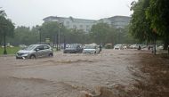 Vehicles make their way through a waterlogged road during heavy rainfall in Chandigarh on July 10, 2023. (Photo by AFP)