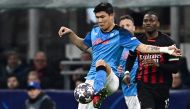 Napoli's South Korean defender Min-jae Kim clears a ball during the UEFA Champions League quarter-finals first leg football match between AC Milan and SSC Napoli on April 12, 2023 at the San Siro stadium in Milan. (Photo by GABRIEL BOUYS / AFP)