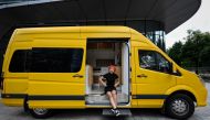 This photo taken on June 21, 2023 shows digital marketer Twiggy He sitting in her recreation vehicle (RV) in Shenzhen city, in southern China's Guangdong province. Photo by Jade GAO / AFP