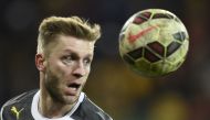 Dortmund's Polish midfielder Jakub Blaszczykowski heads the ball during the German football Cup DFB round of 16 game between German third division Dynamo Dresden and first Bundesliga Borussia Dortmund, in Dresden eastern Germany, on March 3, 2015. Photo by Odd ANDERSEN / AFP