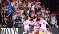 Lionel Messi #10 of Inter Miami CF celebrates with teammates after kicking the game winning goal during the second half of the Leagues Cup 2023 match between Cruz Azul and Inter Miami CF at DRV PNK Stadium on July 21, 2023 in Fort Lauderdale, Florida. Hector Vivas/Getty Images/AFP 